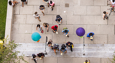 People walking through The University of Michigan campus