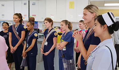 Lindsey (third from left) touring a Thai hospital with classmates