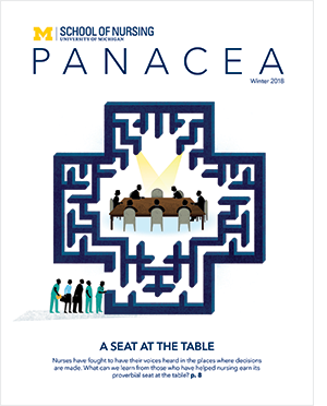 Magazine cover with people sitting at a table in a maze. 