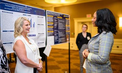 Sherri Fannon, winner of the Alumni/Faculty category chats with Jessica Fladger, winner of the Medvec Innovation award