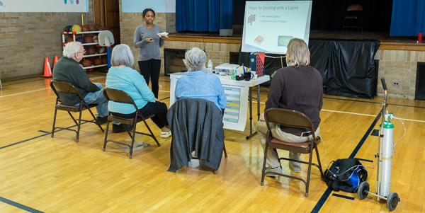 UMSN Research Associate She'Lon Turner preps a group at the start of an exercise session