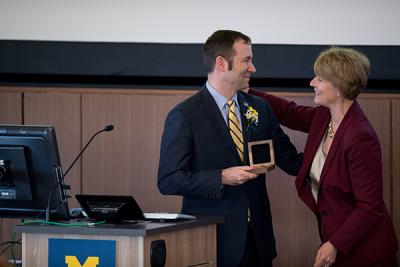 Dean Patricia Hurn presented Friese with a professorship medal