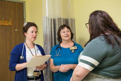 FNP student Emma Pryser and Pardee consult with a patient