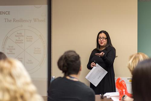 Yasamin Kusunoki teaching local shelter about trauma-informed care