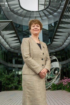 Portrait of Dean Patricia D. Hurn in front of 426 N. Ingalls Building